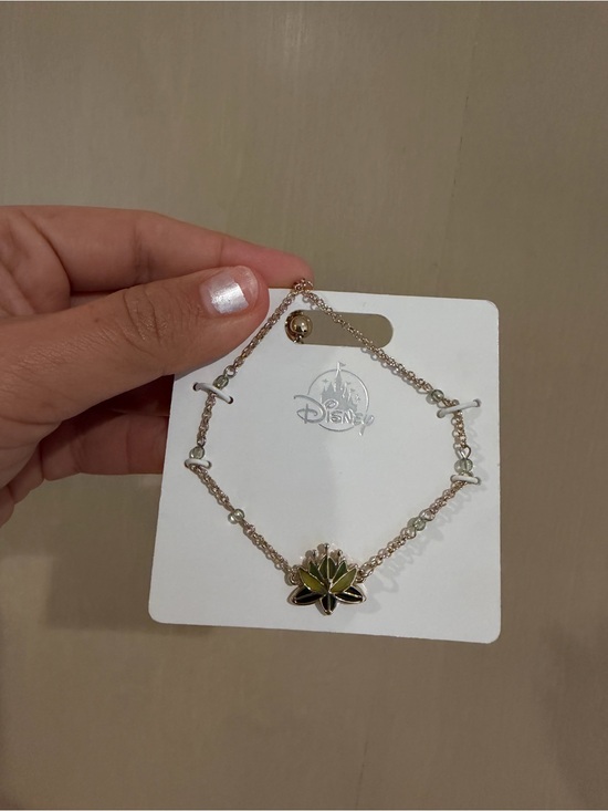 Disney Jewelry - Disney Gold-Tone Tiana Green Lotus Bracelet